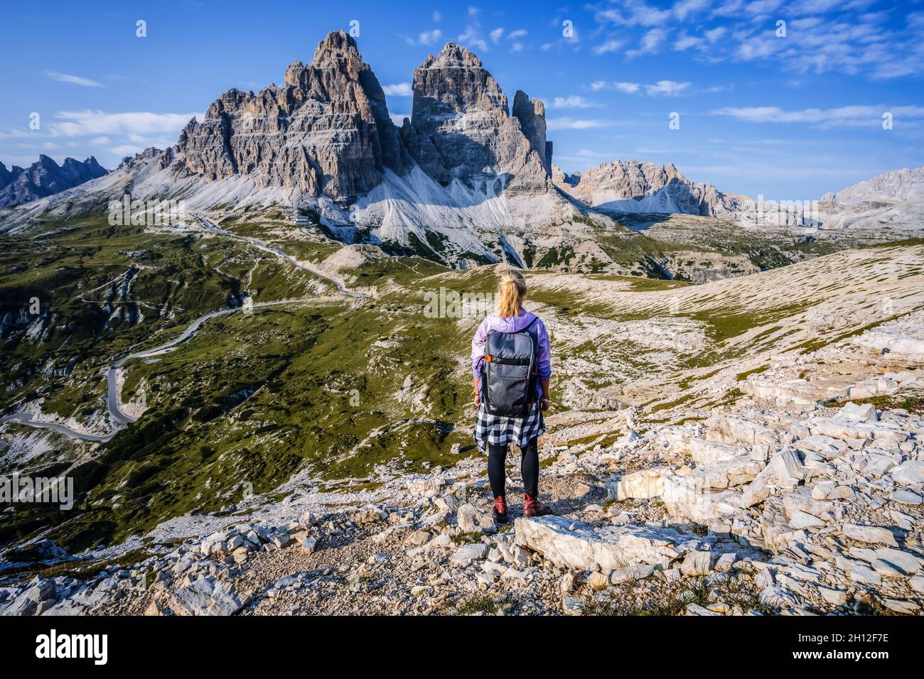 Woman hiker exploring Tre Cime di Lavaredo national park. Trentino-Alto-Adige, Dolomiti, Italy Stock Photo