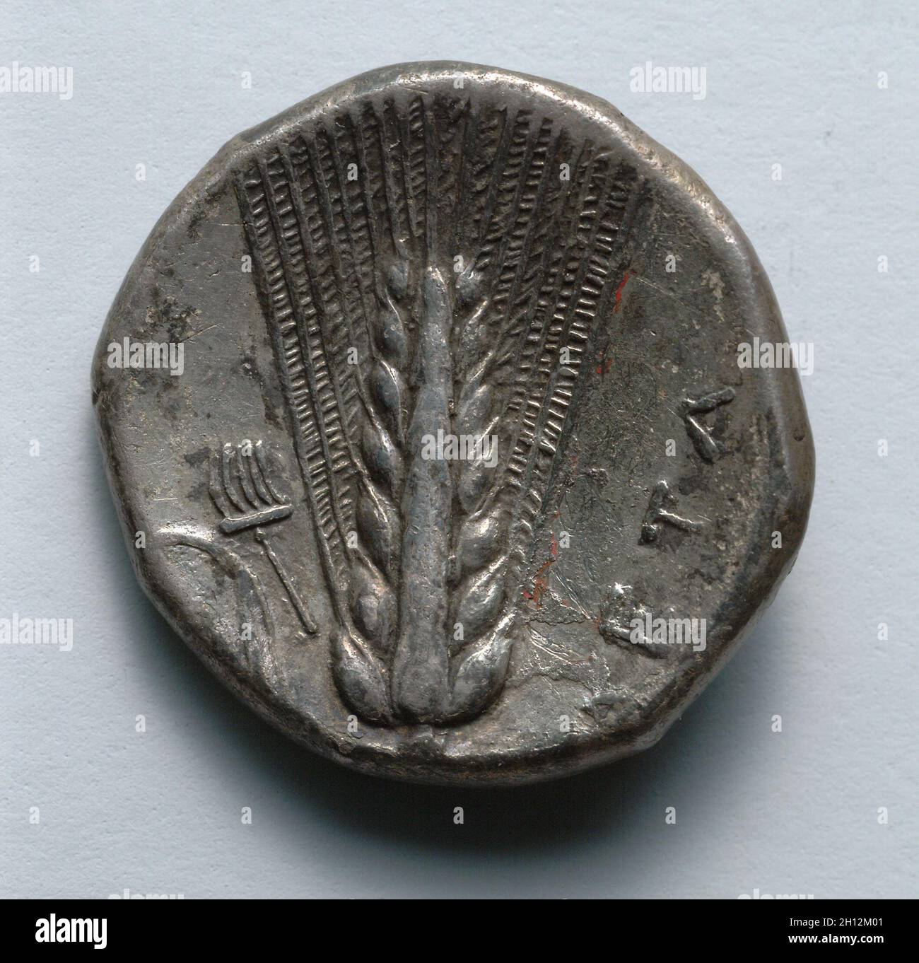 Stater: Barley, rake and leaf left (Reverse), 330-300 BC. Greece, 4th century BC. Silver; diameter: 2.1 cm (13/16 in.). Stock Photo