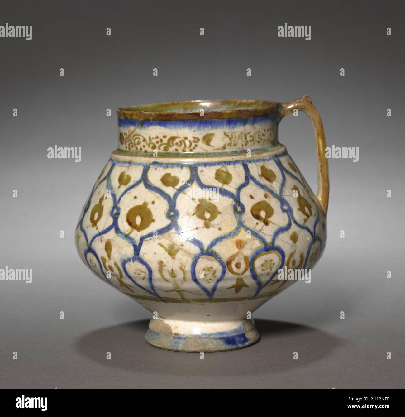 Jug, 1170-1220. Iran, Kashan, Seljuq period of Iran (1037–1194). Fritware with luster-painted design; overall: 14.7 x 17 cm (5 13/16 x 6 11/16 in.). Stock Photo