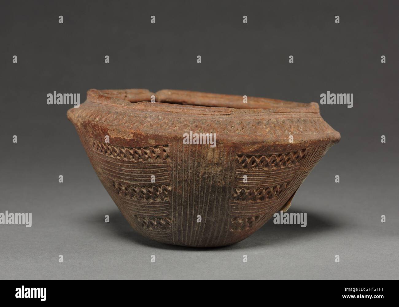 Jar, before 1550. Colombia, 15th-16th century. Red ware with incised patterns; overall: 7.5 x 14 cm (2 15/16 x 5 1/2 in.). Stock Photo