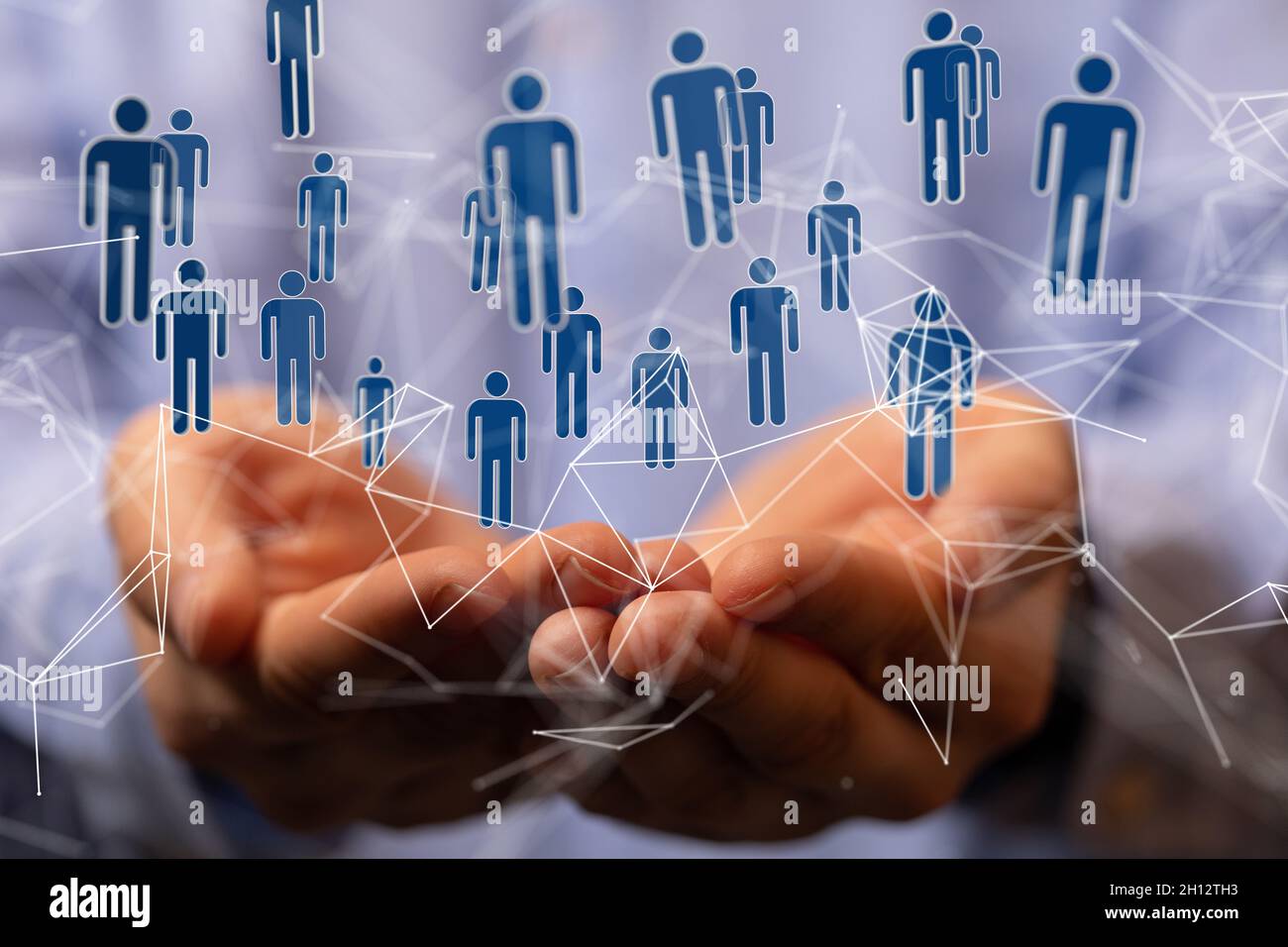 3D rendering of blue person icons network hovering over a man's hands ...