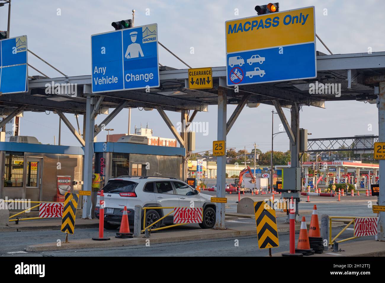 Car pulling up at the Toll Booth on McDonald Bridge over Halifax Harbour. Darmouth, Canada Stock