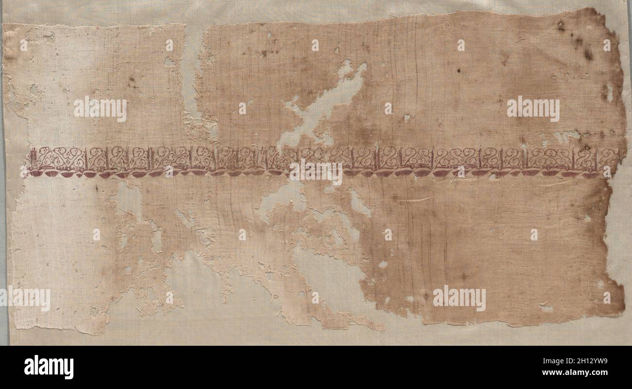 Fragment of a Tiraz, 1036 - 1044. Egypt, Fatimid period, Reign of Caliphate al-Mustansir, c. AH 427-436 (AD 1036-1044). Tabby ground with inwoven tapestry ornament; linen and silk; overall: 24.5 x 47.3 cm (9 5/8 x 18 5/8 in.). Stock Photo