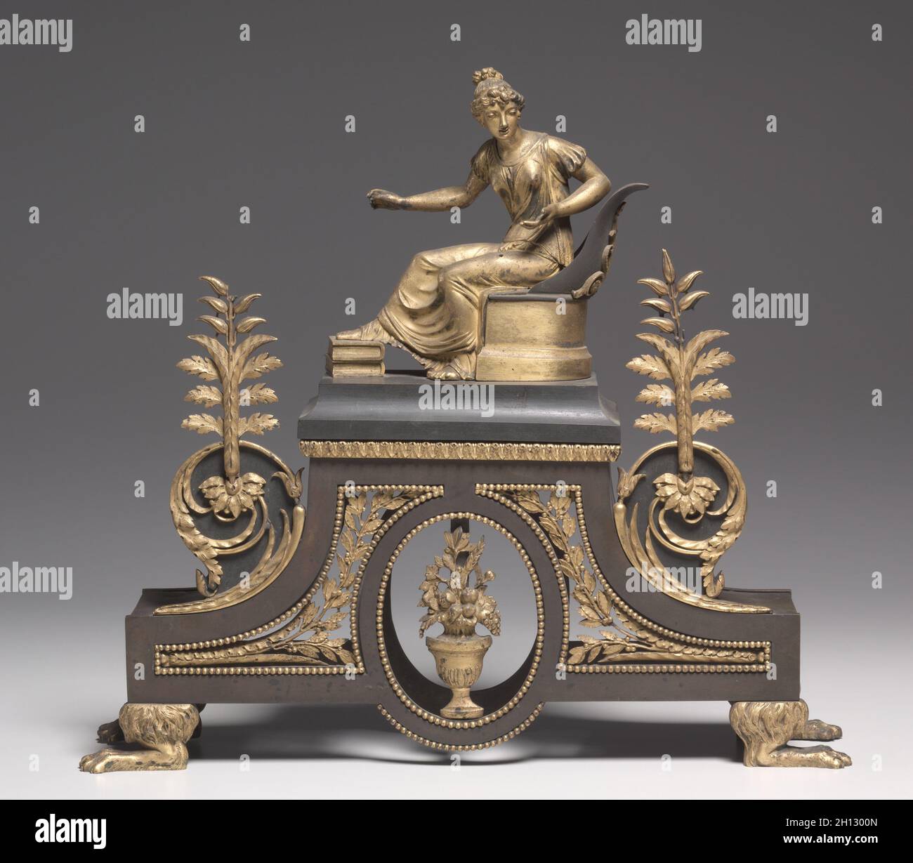 Andiron, c. 1790-1800. France, 18th century. Bronze and gilded bronze; overall: 39.1 x 43.9 x 11.5 cm (15 3/8 x 17 5/16 x 4 1/2 in.). Stock Photo