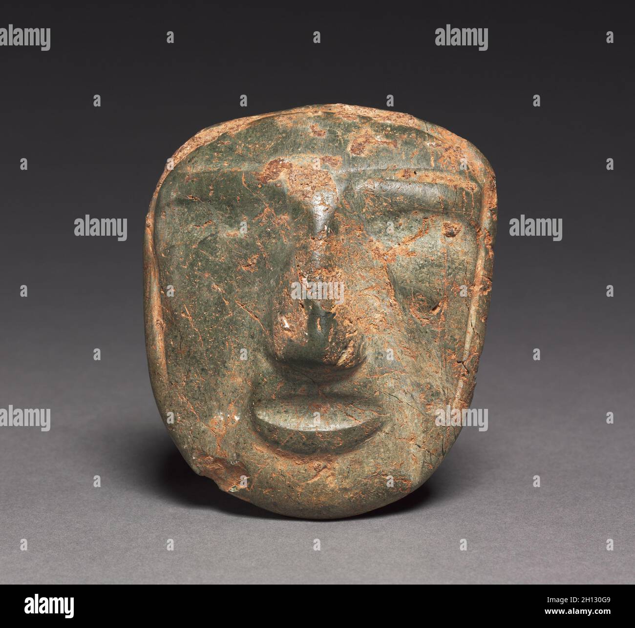 Mask, 1-800. Mexico, Guerrero, Mezcala style. Stone; overall: 10.2 x 9 x 3 cm (4 x 3 9/16 x 1 3/16 in.). Stock Photo