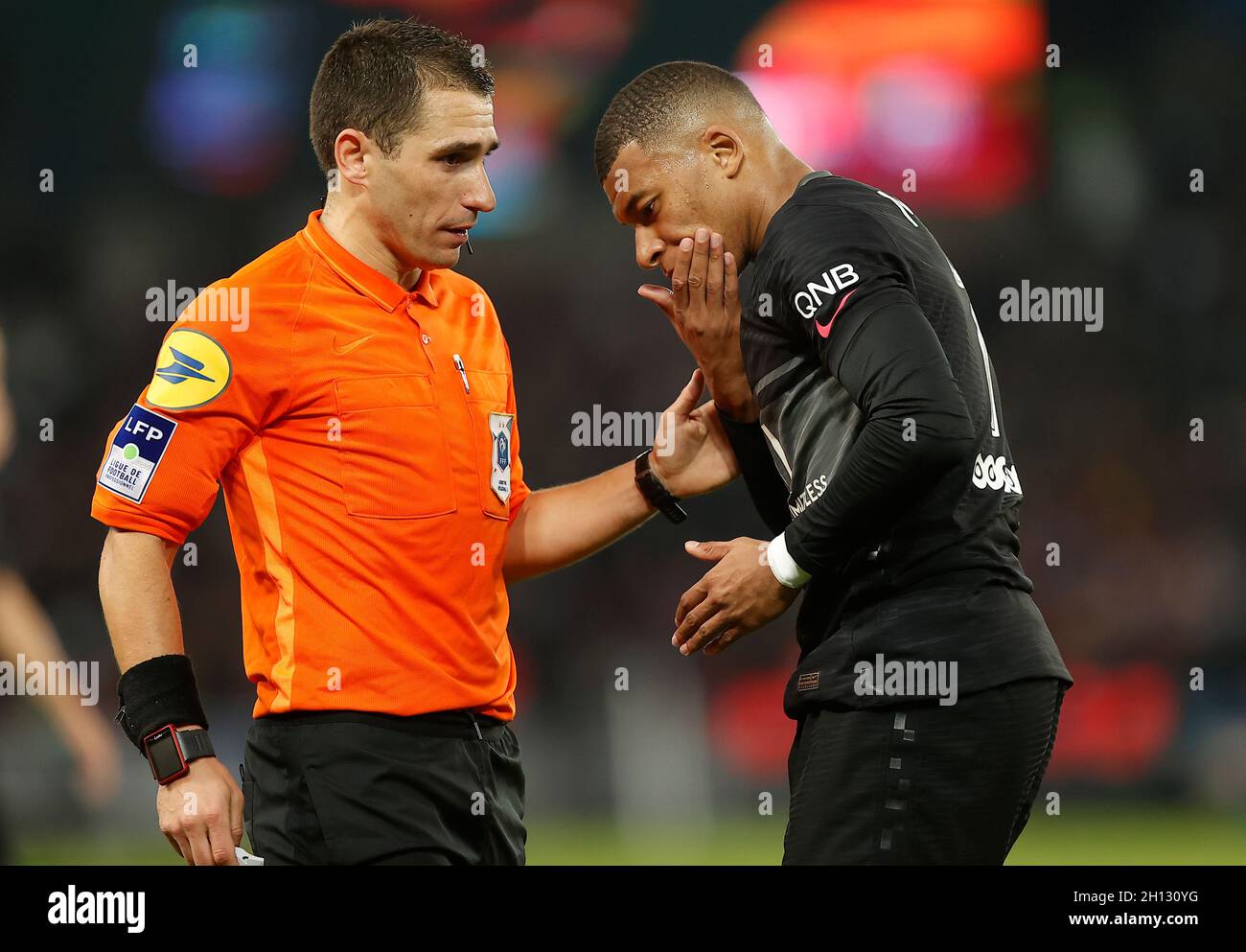 Paris, France. 16th Oct, 2021. Paris Saint Germain's Kylian Mbappe (R) speaks with the referee after being injured during a French Ligue 1 football match between Paris Saint Germain (PSG) and Angers SCO in Paris, France, Oct. 15, 2021. Credit: Xinhua/Alamy Live News Stock Photo