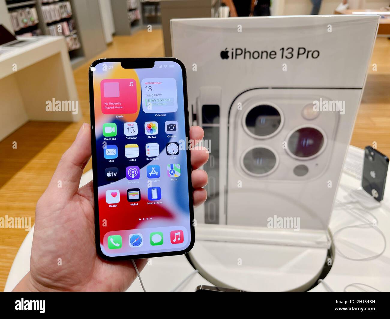 Bangkok, Thailand - October 13, 2021: Hands on iPhone 13 series are shown to sell in iStudio By Comseven - EMQUARTIER DEPARTMENTSTORE in Bangkok, Thai Stock Photo