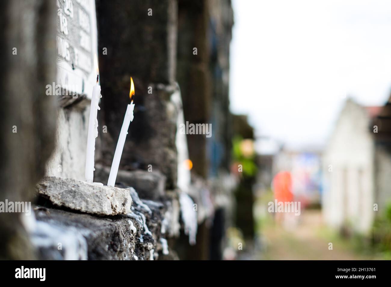 Lighted candle placed in front of the apartment tomb upon a visit to a