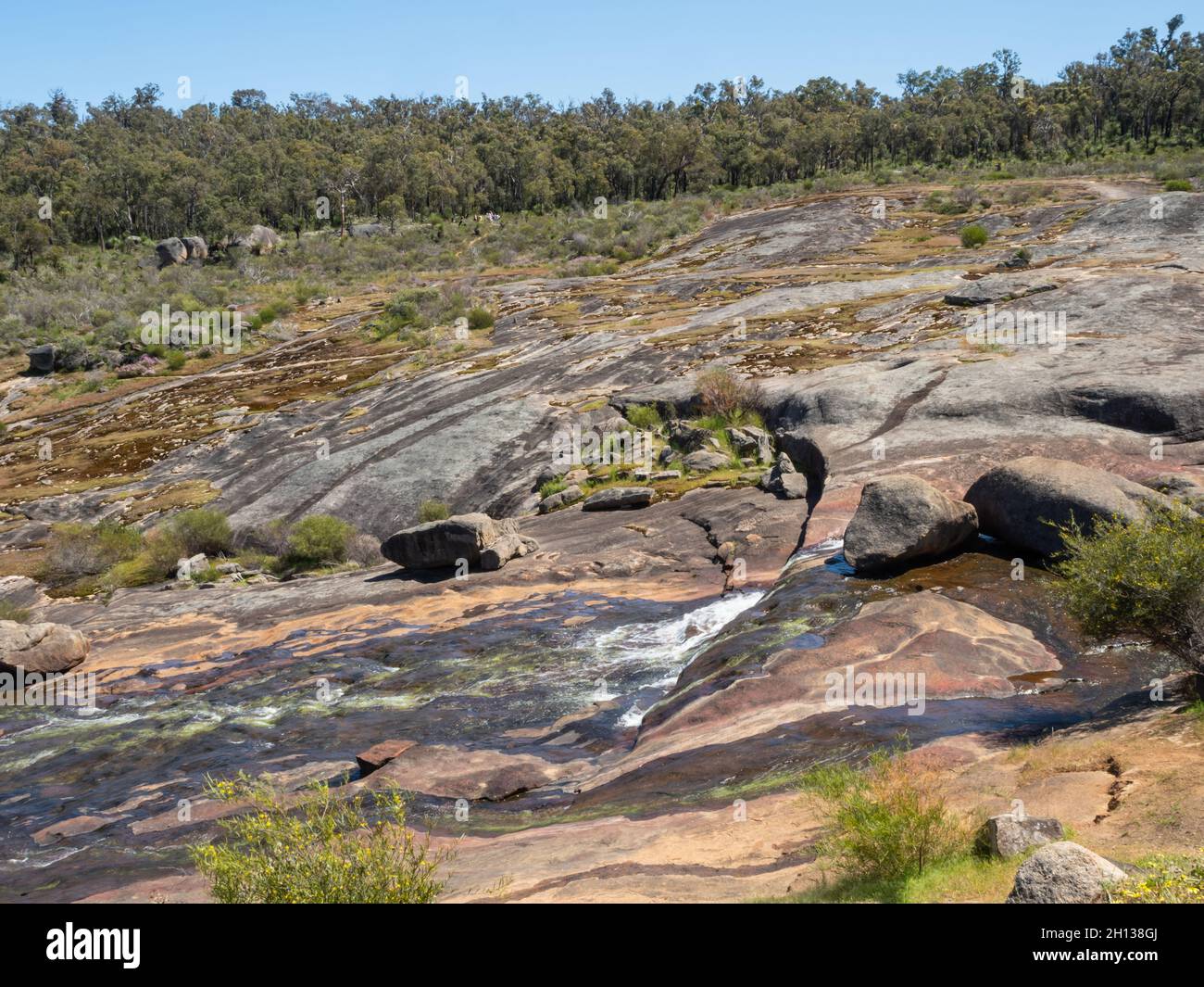 Hovea Falls on the Jane Brook in John Forrest National Park, near Perth in Western Australia, cascades down a large granite sheet. Stock Photo