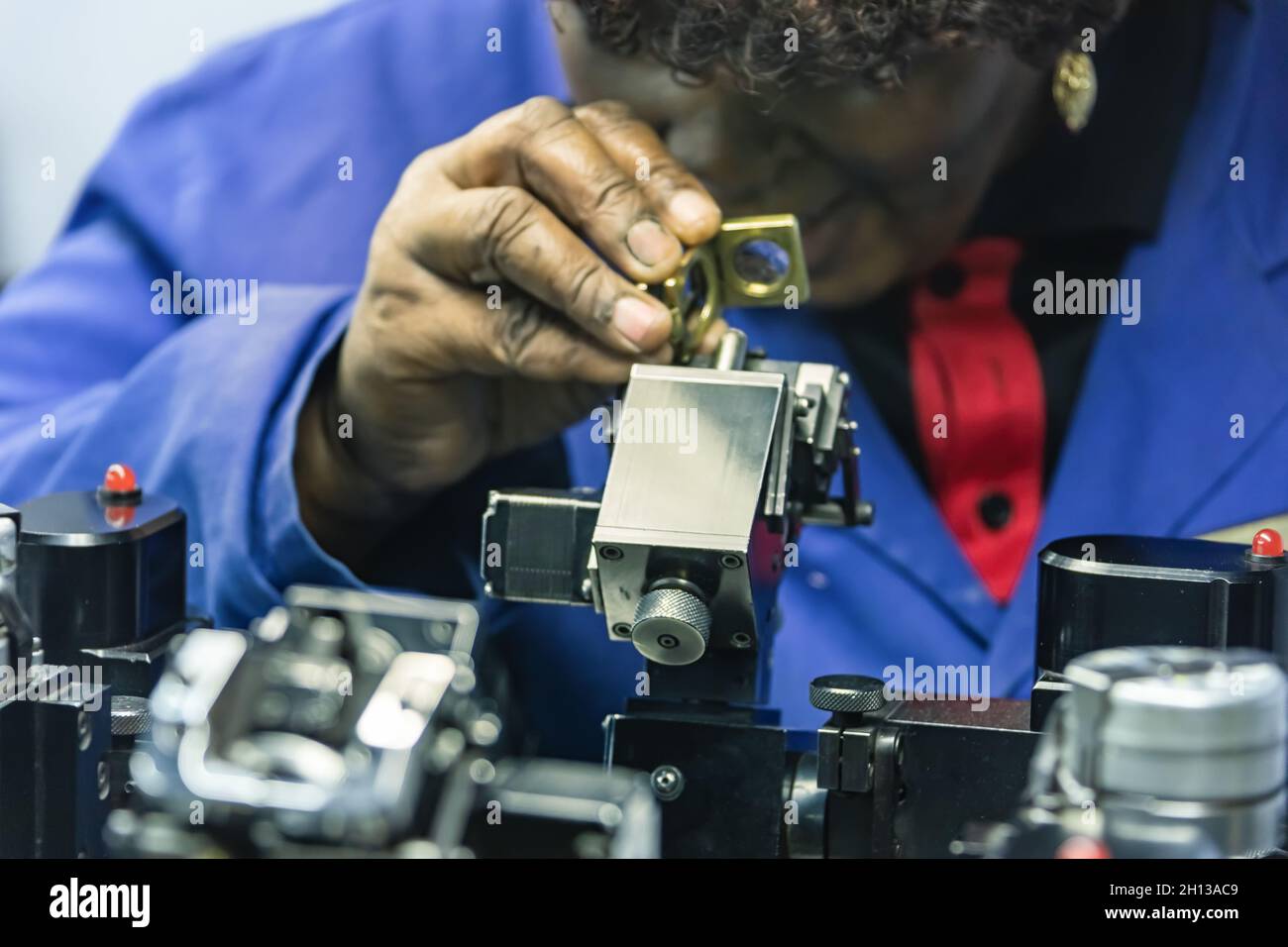 Machines to polish diamonds, grading diamonds, african woman working. In Africa , Botswana Stock Photo