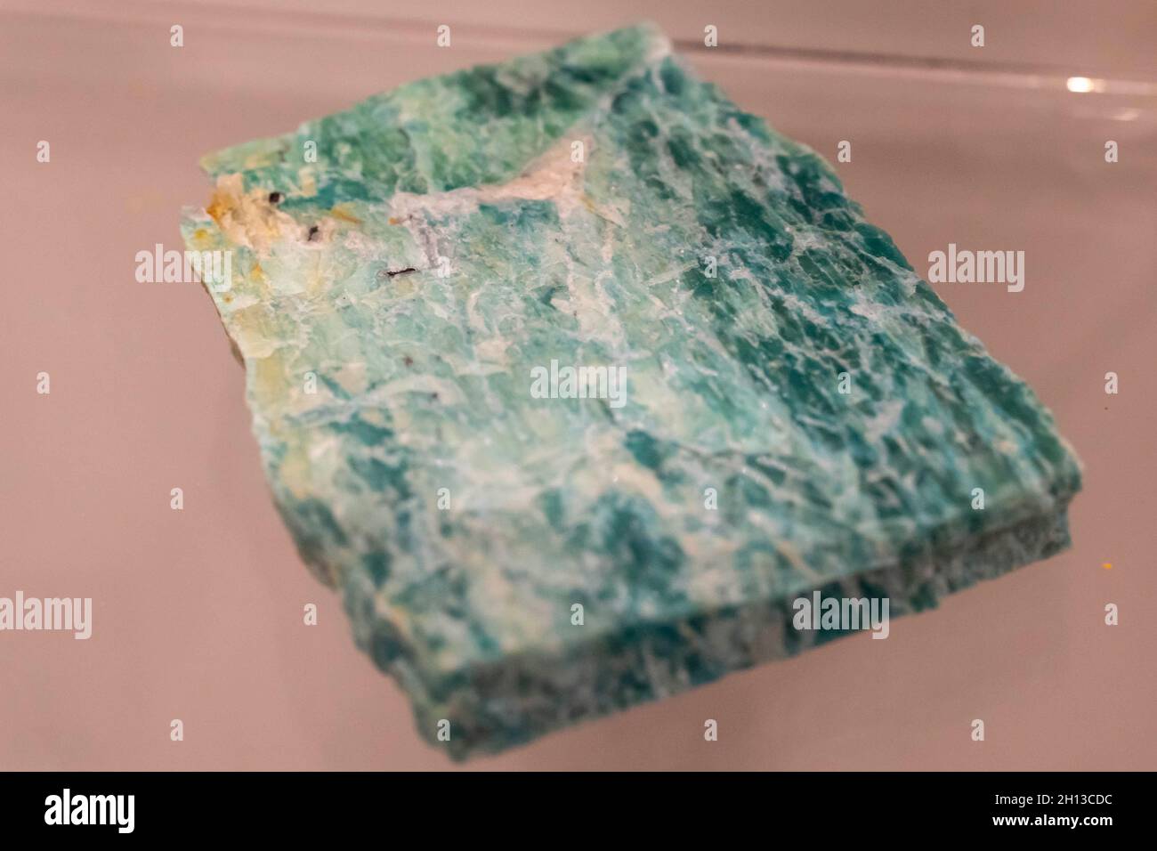Amazonite green collection stone on display (selective focus). Stock Photo