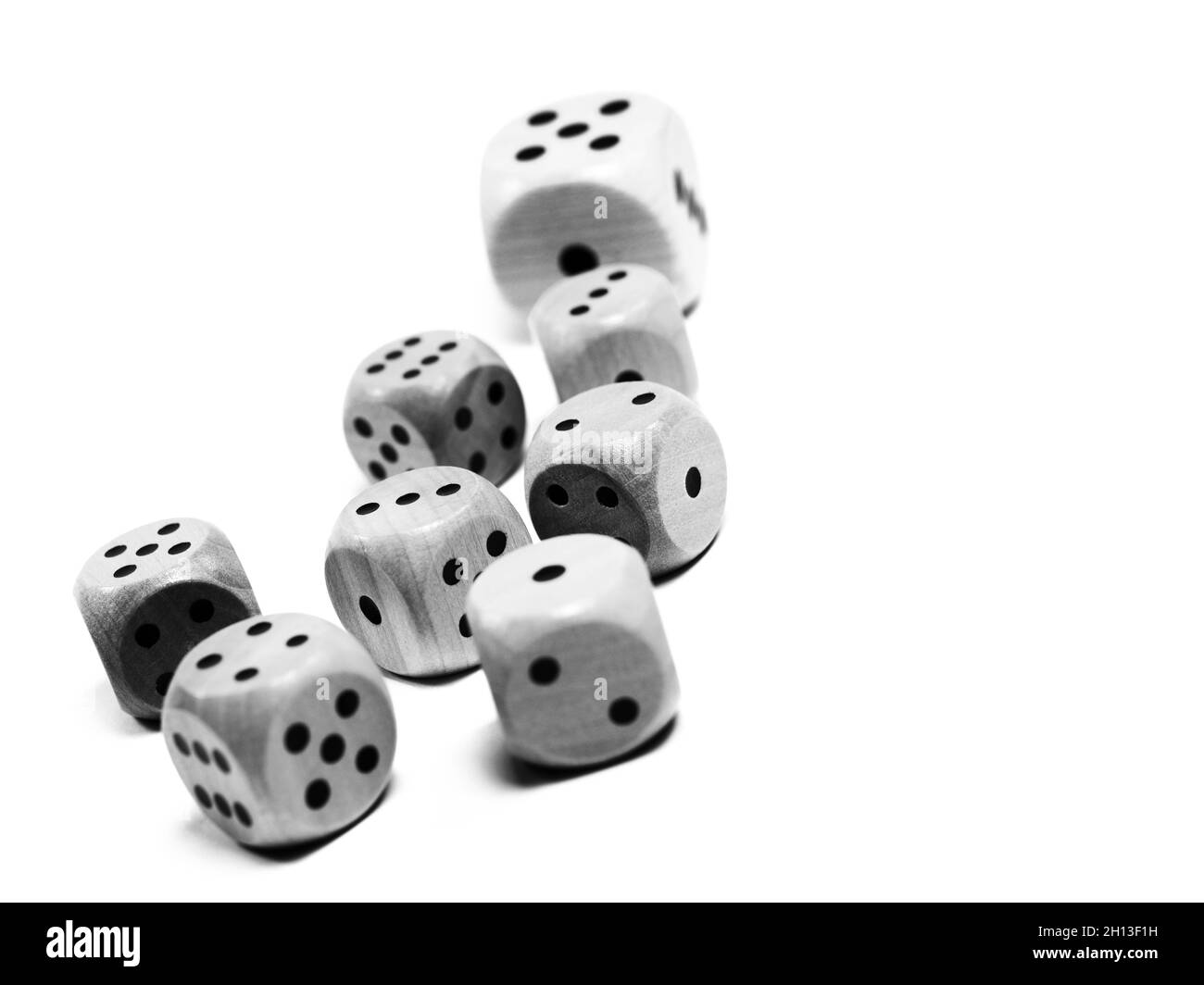 Wooden game dice against a white background Stock Photo Alamy