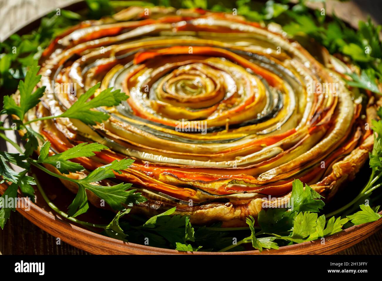 Vegetable pie Mexican sun. Round open pie made from zucchini, eggplant