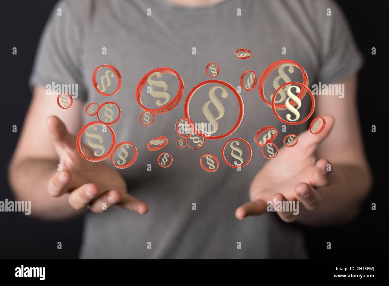 Abstract shot of a man presenting 3D rendered law and justice symbols ...