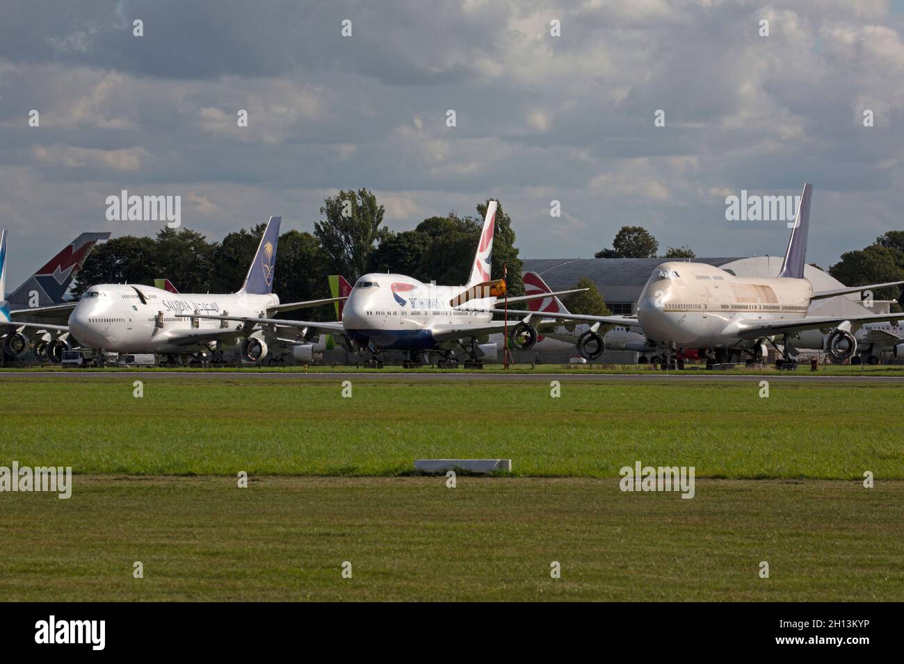 A row of Boeing 747 airliners at Cotswold Airport in England, waiting to be scrapped. Stock Photo