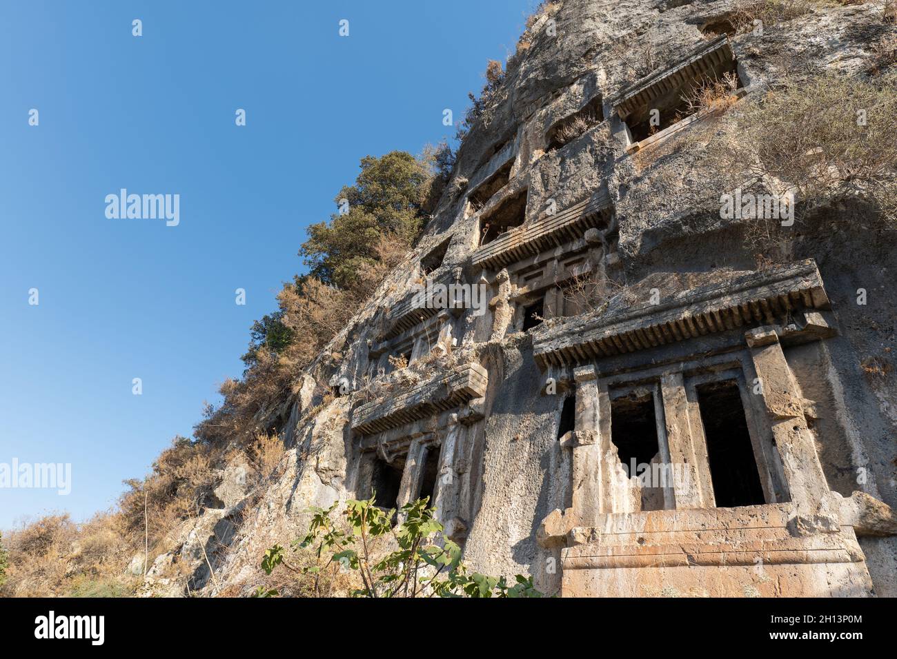 Tomb of Amyntas,  the Fethiye Tomb. View of the tombs carved into the rock from the time of the ancient state of Lycia. Stock Photo