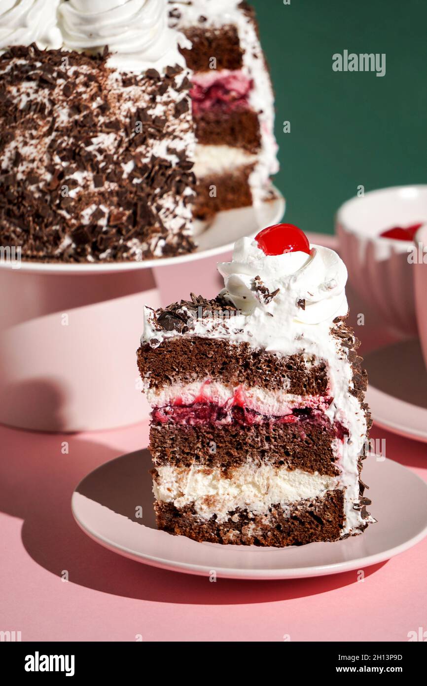 Schwarzwalder Kirschtorte, black forest cake, harsh light, table