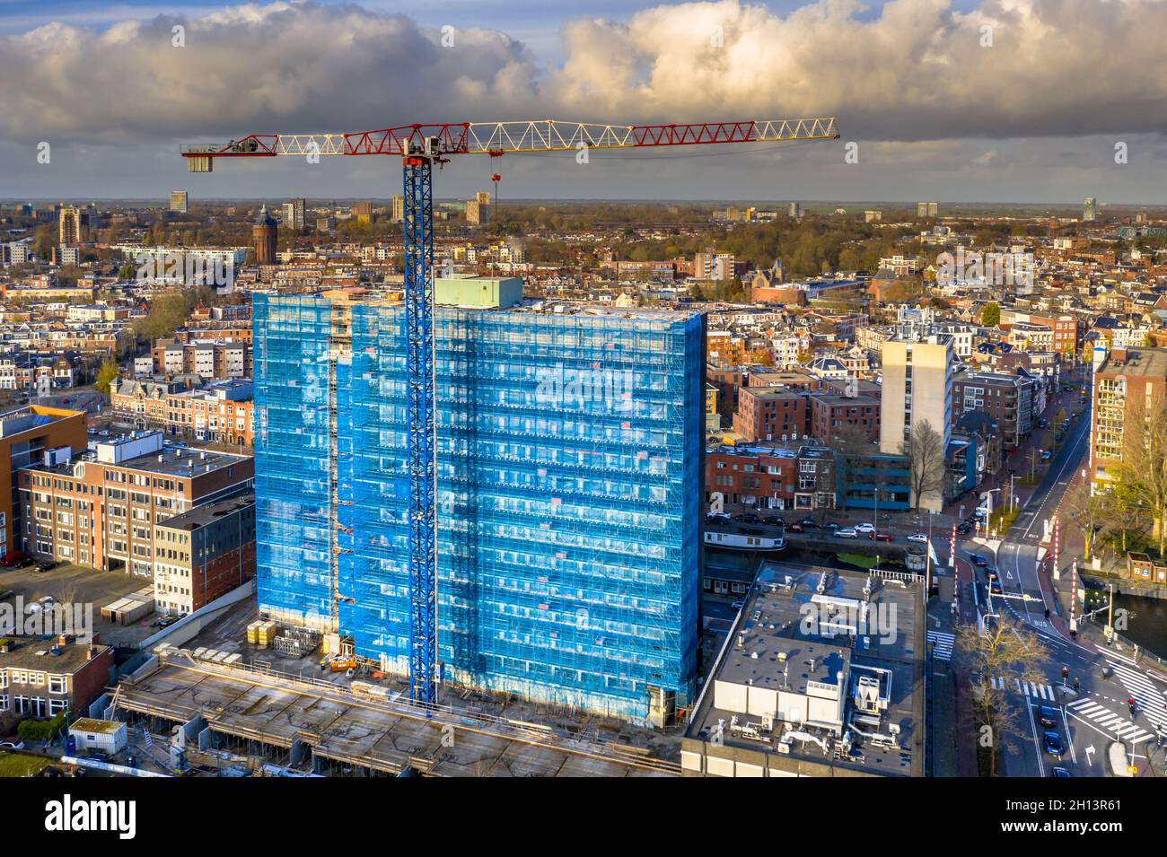 Aerial view of construction crane building high rise apartment building