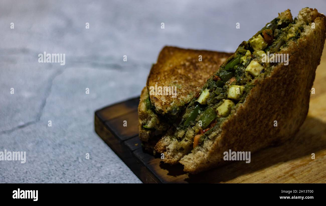 sandwich is famous all around the globe. it is basically made from bread, veggies, cheese, spices, or chutneys. Stock Photo