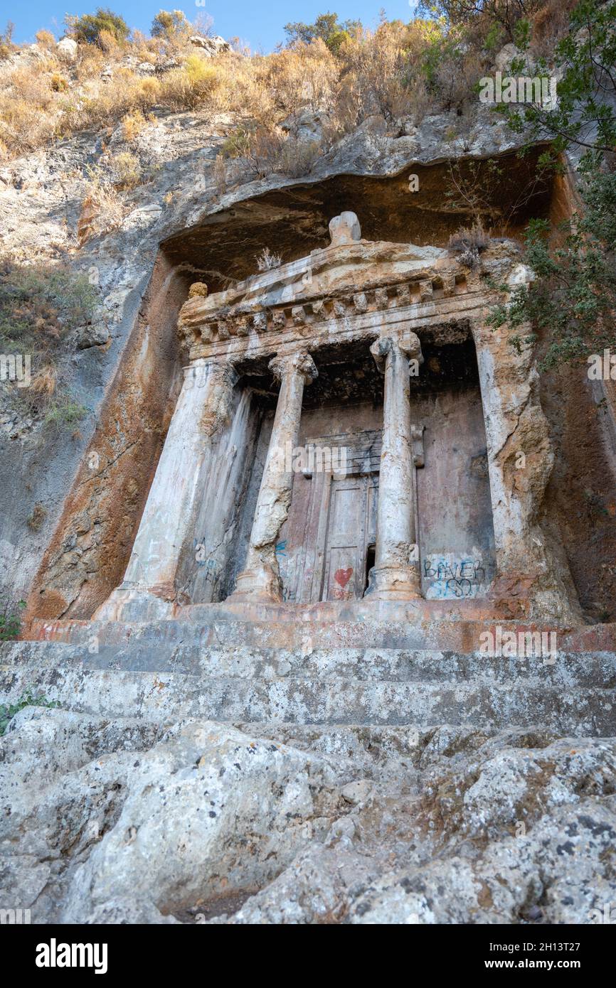 Tomb of Amyntas,  the Fethiye Tomb. View of the tombs carved into the rock from the time of the ancient state of Lycia. Stock Photo