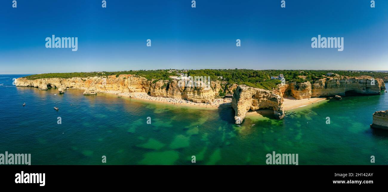 Aerial drone views of Praia da Marinha and Malhada do Baraco - beaches ...
