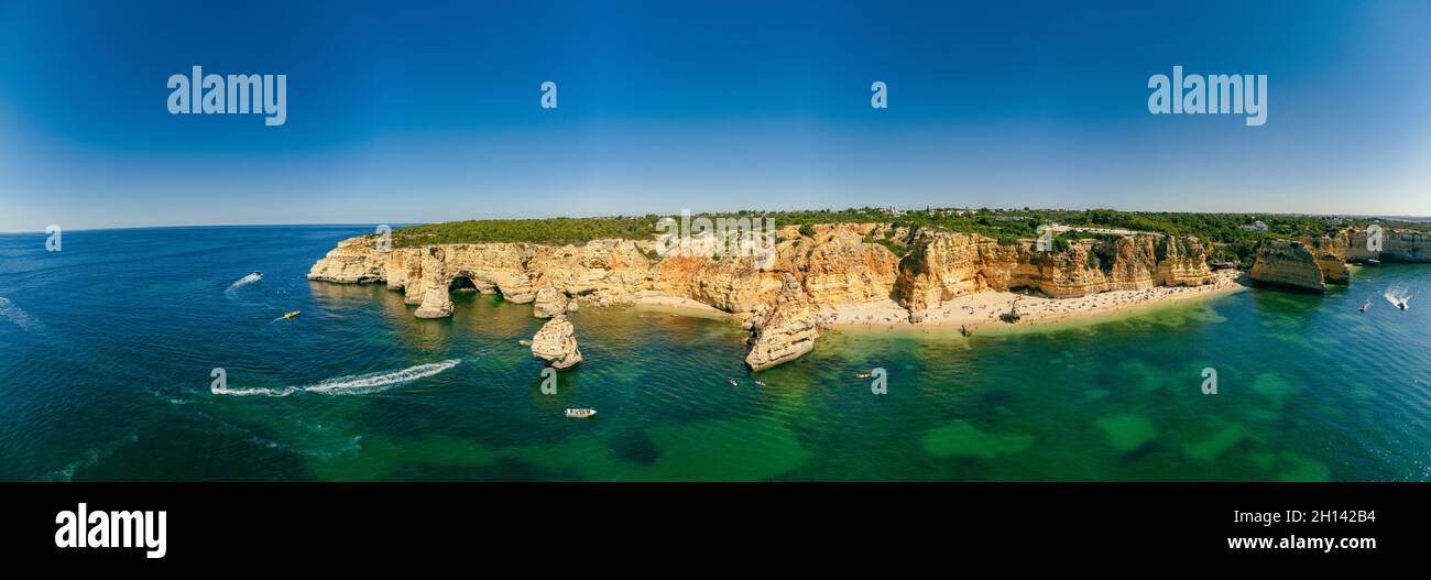 Aerial drone views of Praia da Marinha and Malhada do Baraco - beaches ...
