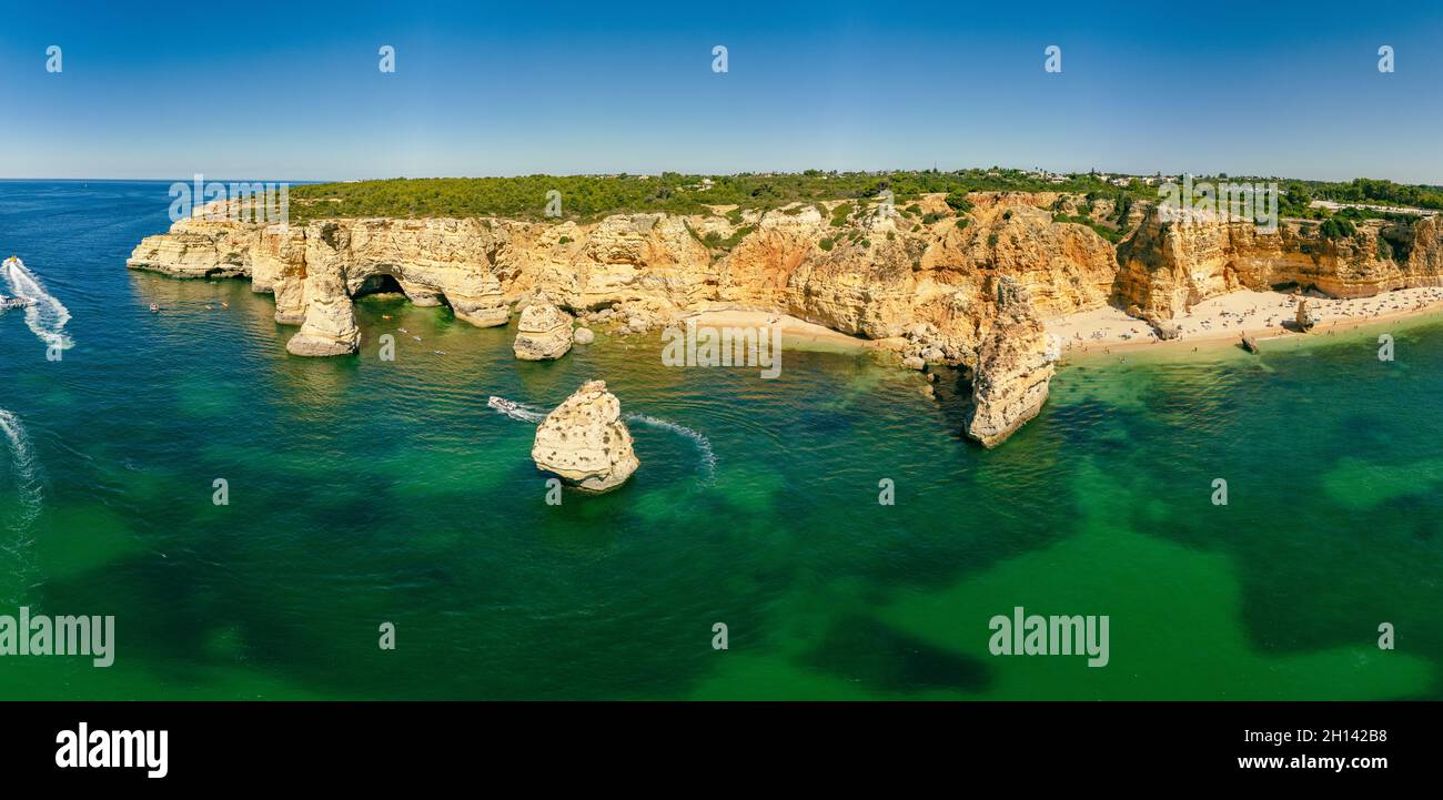 Aerial drone views of Praia da Marinha and Malhada do Baraco - beaches ...