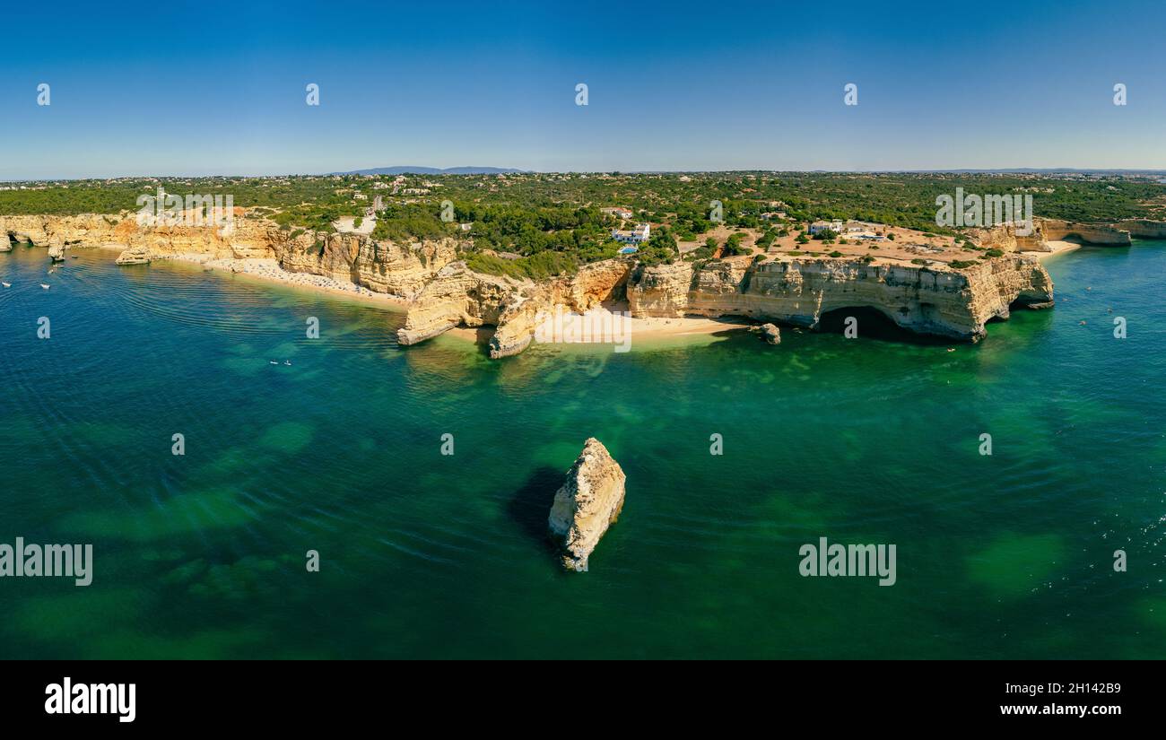 Aerial drone views of Praia da Marinha and Malhada do Baraco - beaches ...