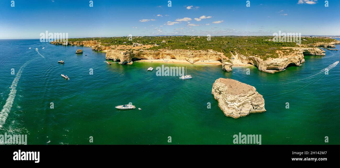Aerial drone views of Praia da Marinha and Malhada do Baraco - beaches ...