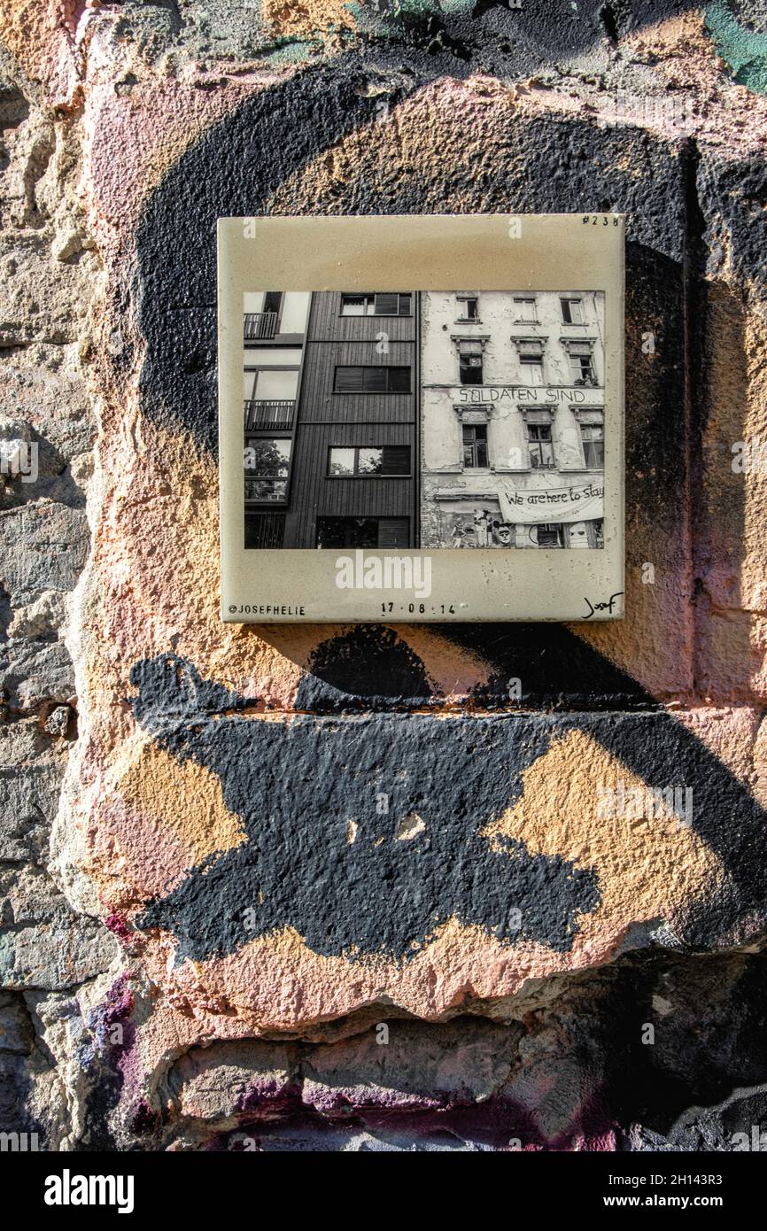 Josef Helie Tile with photograph of new and old building on Exterior of Squat building, 206 Linien strasse, Mitte,Berlin Stock Photo