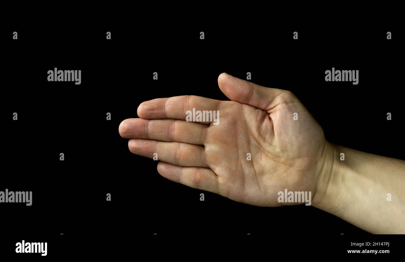 Five fingers of a human hand, hand on a black background, Man reaches out a hand Stock Photo