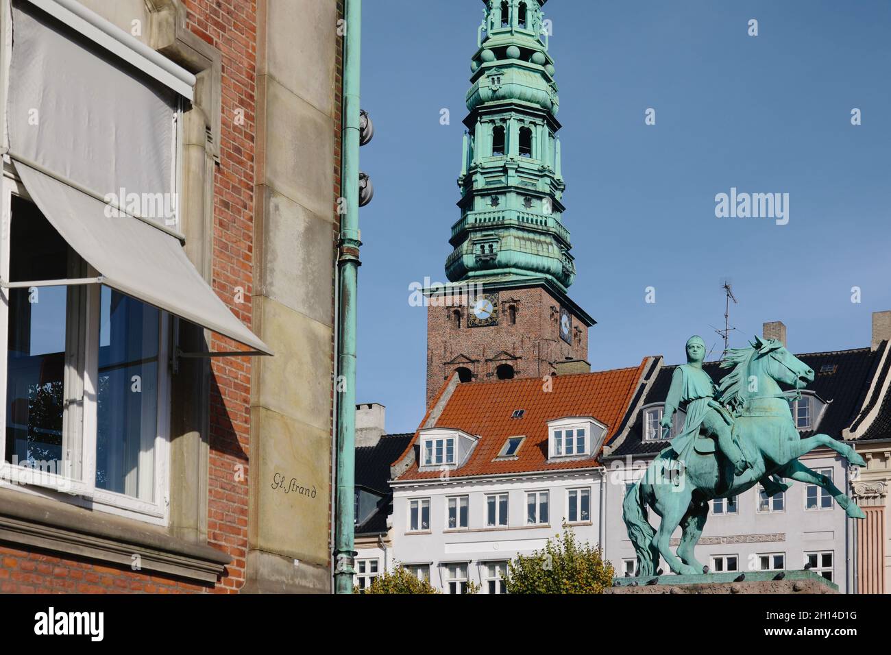 Nikolaj Contemporary Art Center (former St Nicholas Church) and Bishop Absalon statue, Copenhagen, Denmark, Scandinavia, October 2021 Stock Photo