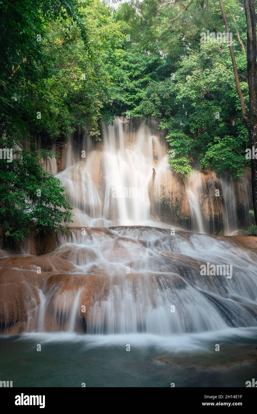Beautiful Sai Yok Noi waterfall flowing on limestone in tropical ...