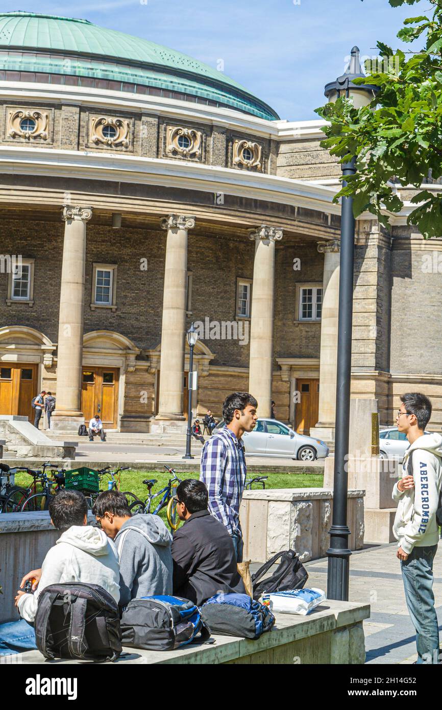 Toronto Canada,King's College Road,University of Toronto Convocation Hall campus,students Asian boys teen teens teenagers male between classes school Stock Photo