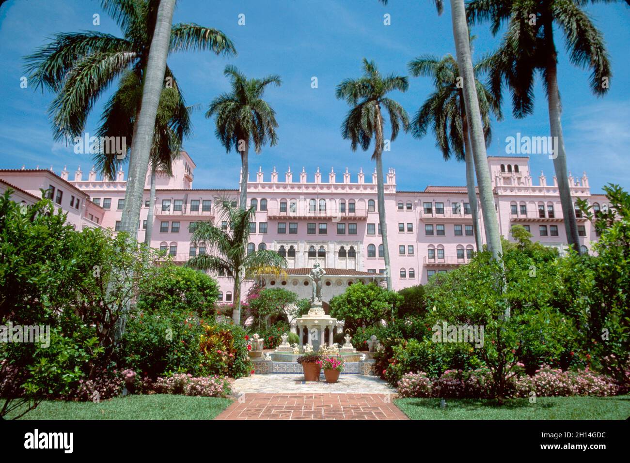 Boca Raton Florida Resort & Club fountain,hotel entrance outside exterior Mediterranean style architecture,upscale luxury pink property palm trees Stock Photo