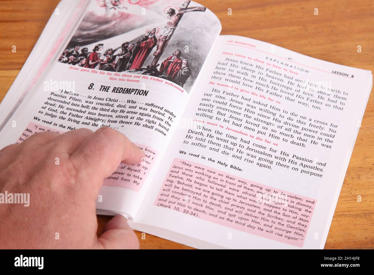 Man reading 'The Redemption' Baltimore Catechism by Father