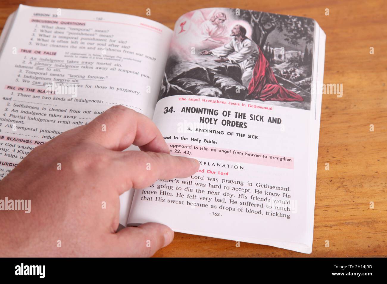 Man reading 'Anointing of the Sick and Holy Orders' Baltimore Catechism