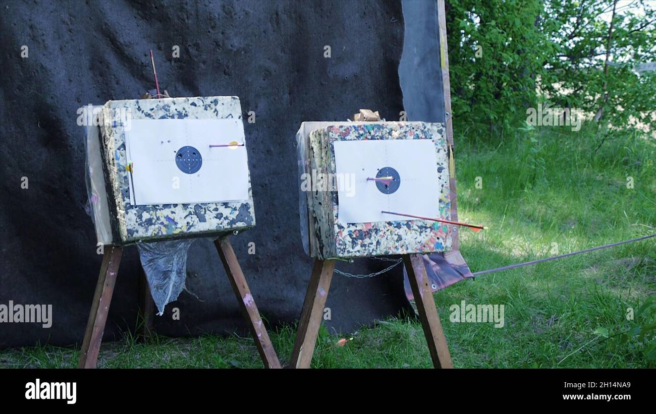 Arrow hits the target. Clip. Bow Arrows hitting a bullseye target at