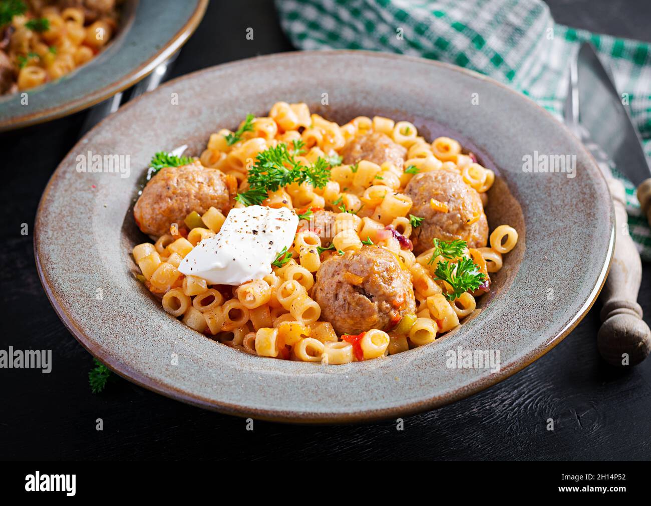 Italian traditional ditalini pasta with meatballs in tomato sauce and