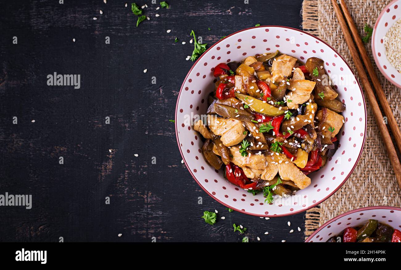 Stir fry with chicken, eggplant, zucchini and sweet peppers Chinese