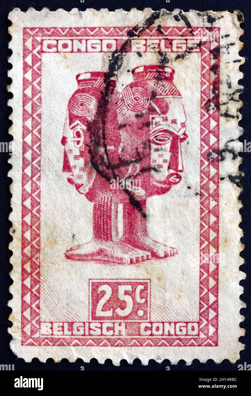 BELGIAN CONGO - CIRCA 1948: a stamp printed in Belgian Congo shows Mbuta, sacred double cup, carved with two faces, man and woman, Baluba tribe, circa Stock Photo