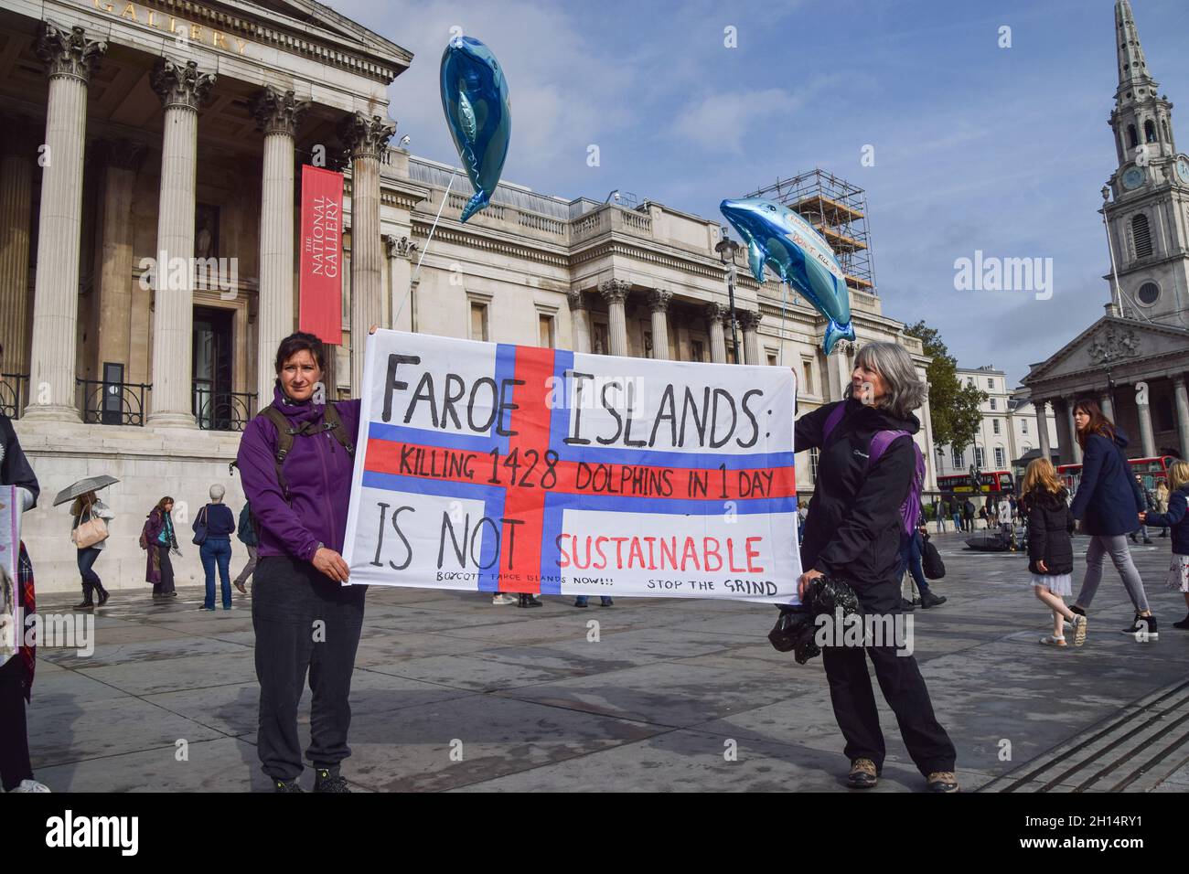 London, UK. 16th October 2021. Protesters in Trafalgar Square. Sea Shepherd and other activists marched through Westminster, calling for an end to the slaughter of dolphins in Faroe Islands and Taiji, Japan. Credit: Vuk Valcic / Alamy Live News Stock Photo