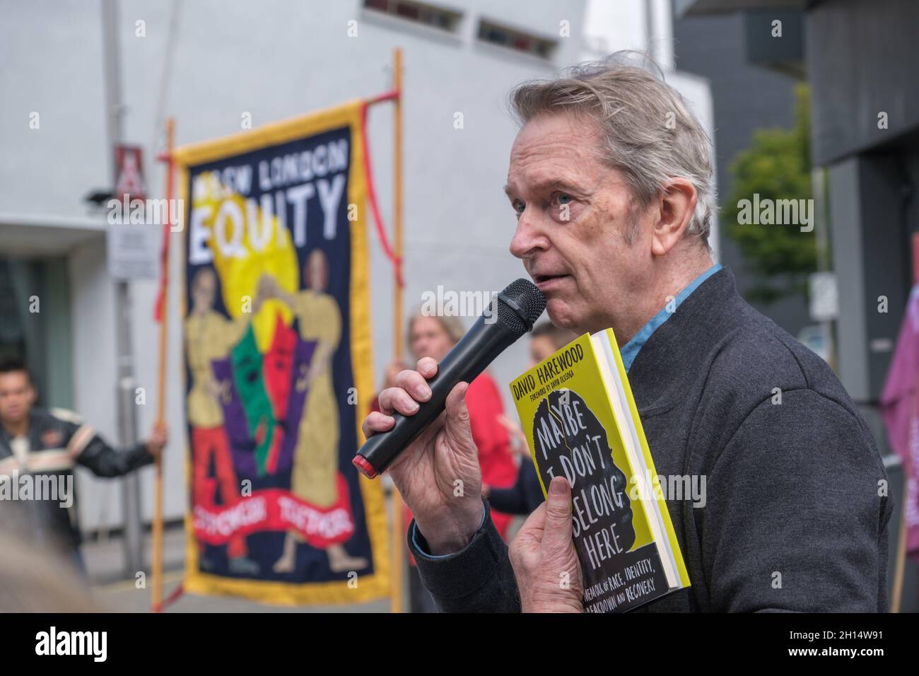 London, UK. 16th October 2021. Artistic director of Theatre Royal Stratford 1979 to 2004 Philip Hedley talks of the great theatrical tradition begun by Joan Littlewood who he worked under as assistant director at the Equity rally in Theatre Square Stratford calling on Newham Council to continue its support for the Stratford Circus area as a bespoke Arts zone and professional cultural hub alongside proposed youth arts services. Peter Marshall/Alamy Live News Stock Photo