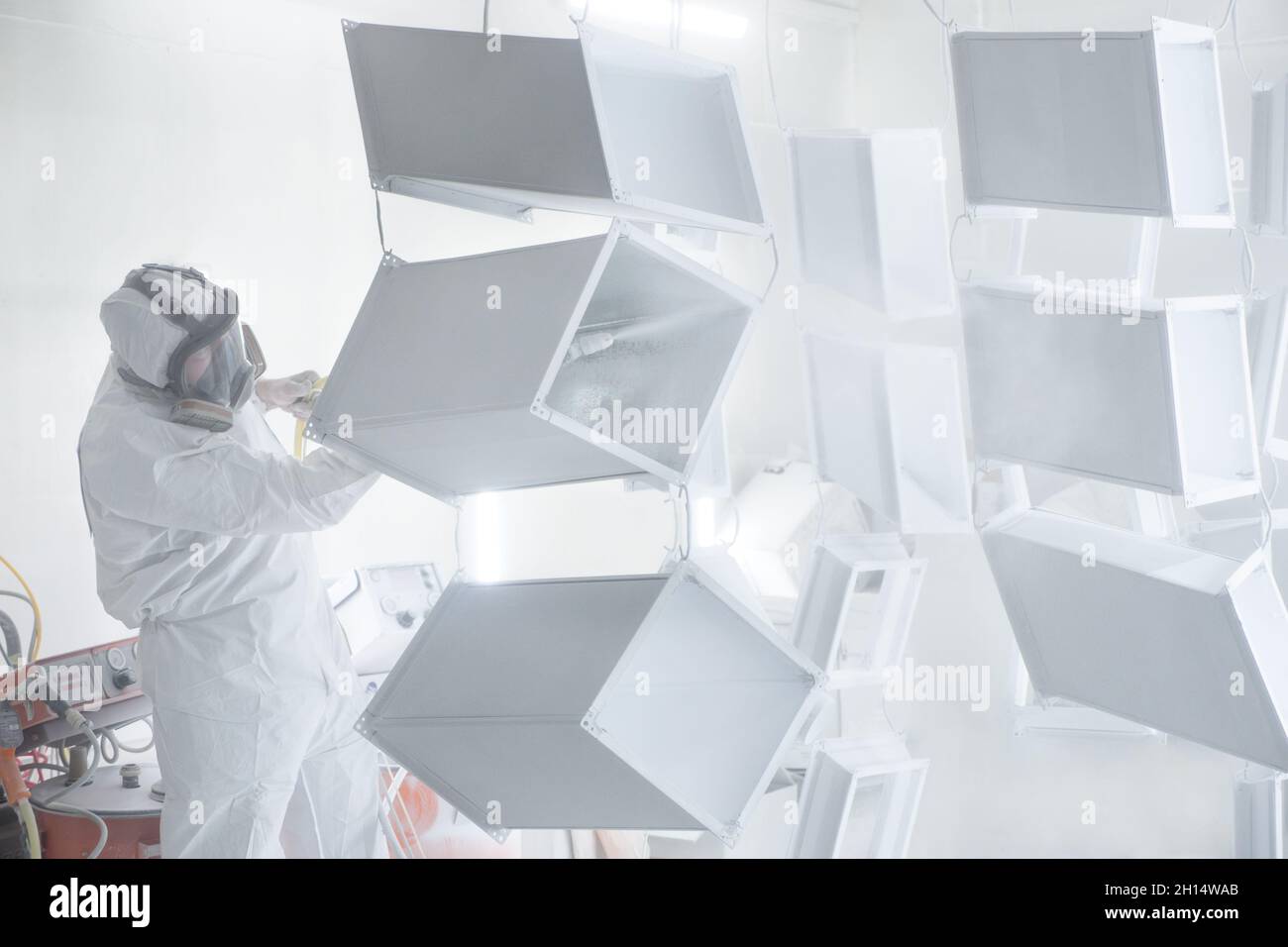 Metalwork workpiece factory paint air spray. Powder coating of metal