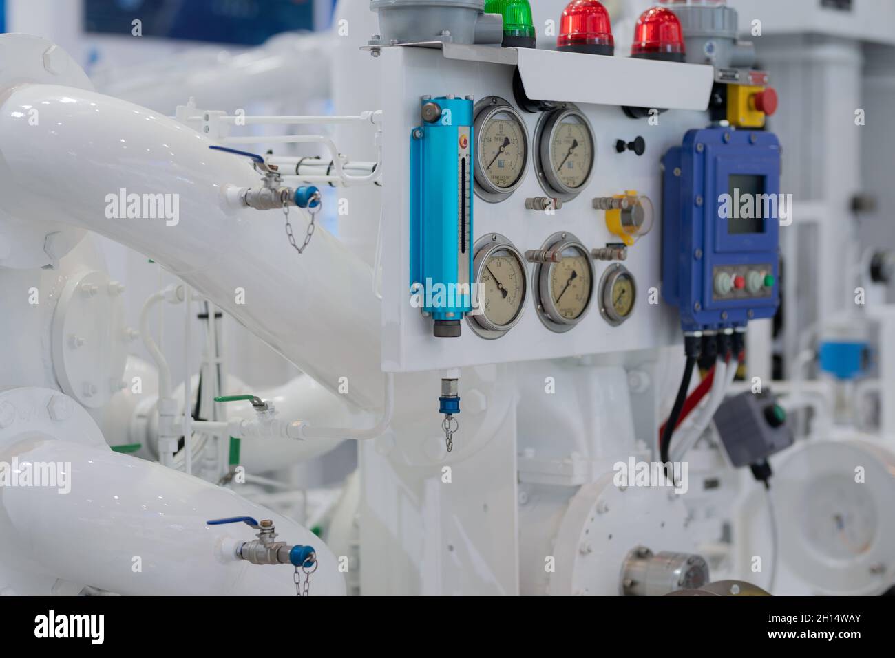 Closeup shot of a compressor and pipeline with a control device in a ...