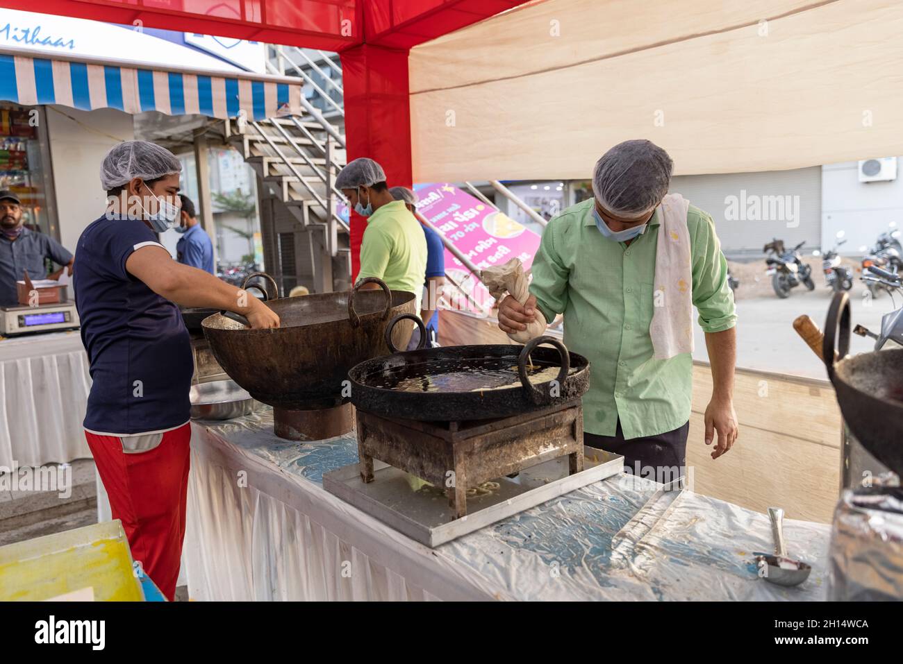 Preparing Sweet dish (Jalebi) and savory (ganthiya) during Dussehra celebrations in Gandhinagar, Gujarat, India Stock Photo