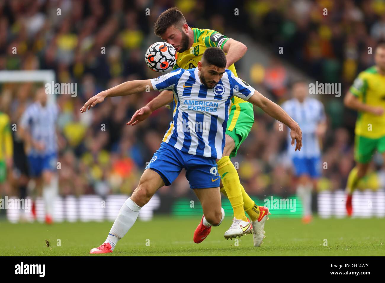 Carrow Road, Norwich, UK. 16th Oct, 2021. Premier League football, Norwich City versus Brighton and Hove Albion; Grant Hanley of Norwich City competes for the ball with Neal Maupay of Brighton Credit: Action Plus Sports/Alamy Live News Stock Photo