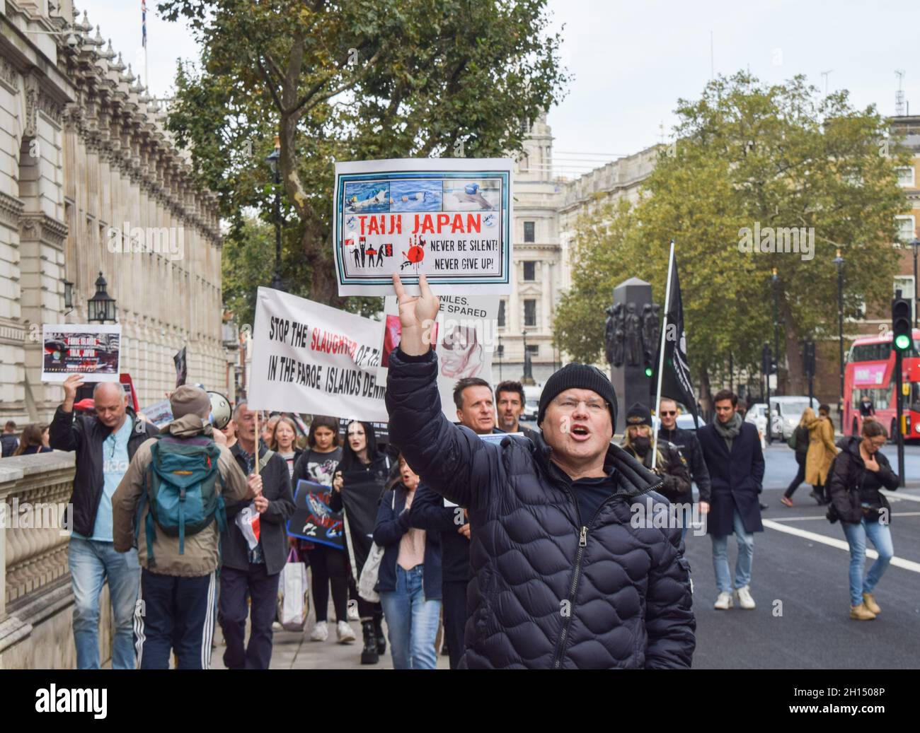 London, UK. 16th October 2021. Protesters in Whitehall. Sea Shepherd and other activists marched through Westminster, calling for an end to the slaughter of dolphins in Faroe Islands and Taiji, Japan. Credit: Vuk Valcic / Alamy Live News Stock Photo