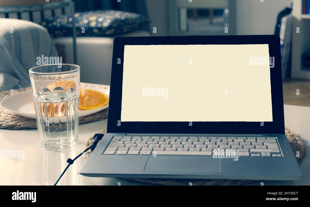 Stylish workplace with laptop at home. Place to write on a laptop Stock