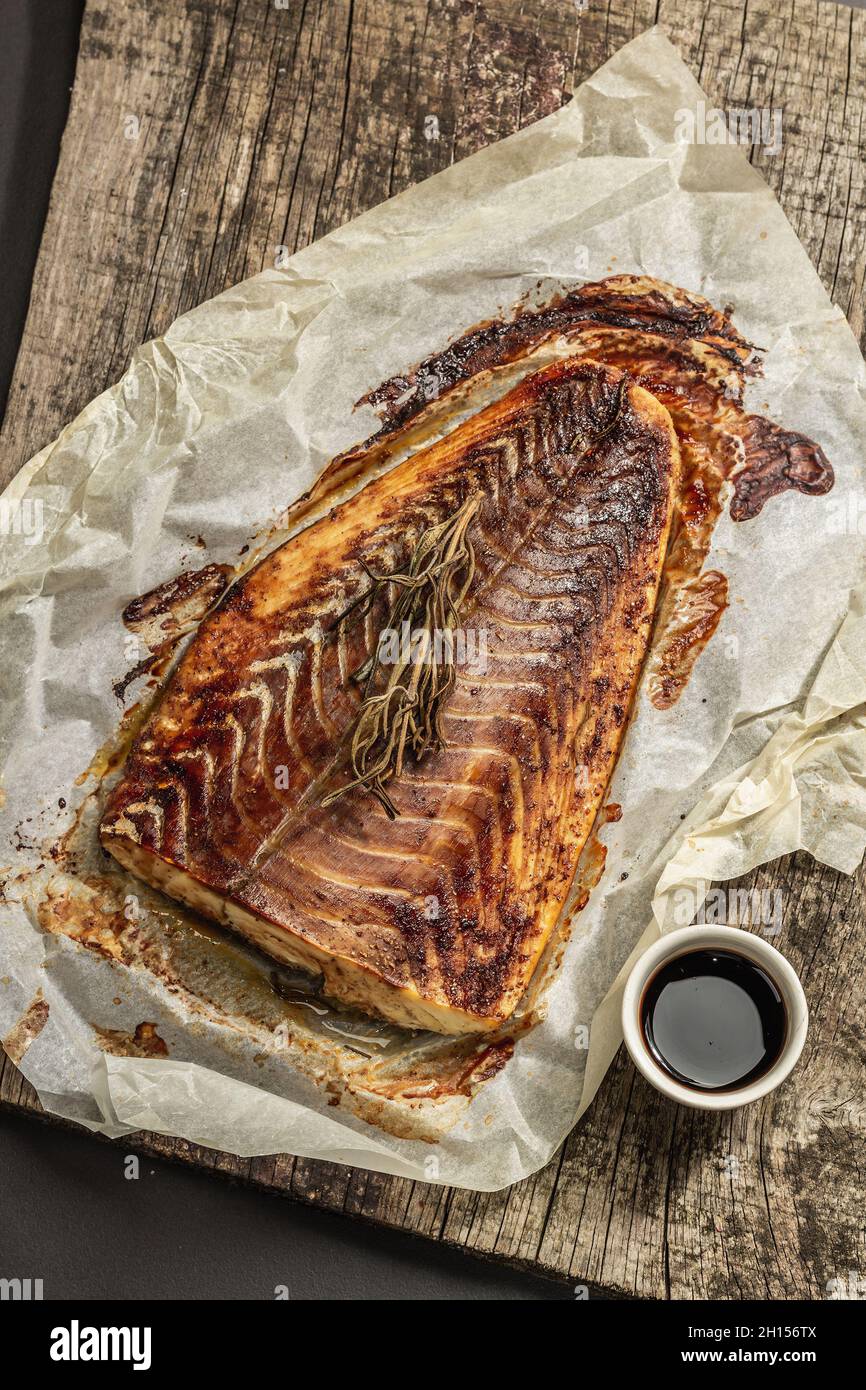 Baked pollock (Pollachius virens) fillet. Fish with teriyaki sauce for